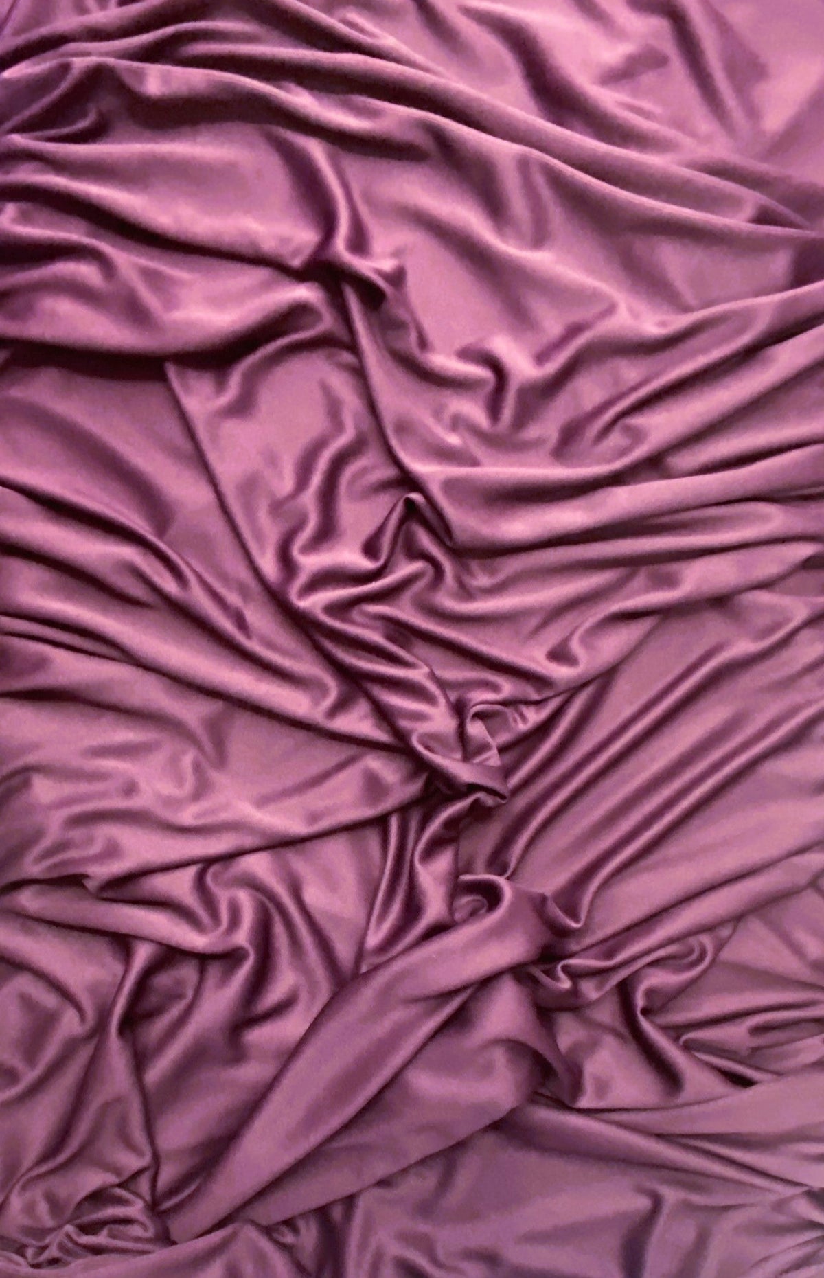 Plum stretch polyester lining fabric with a soft matte surface finish